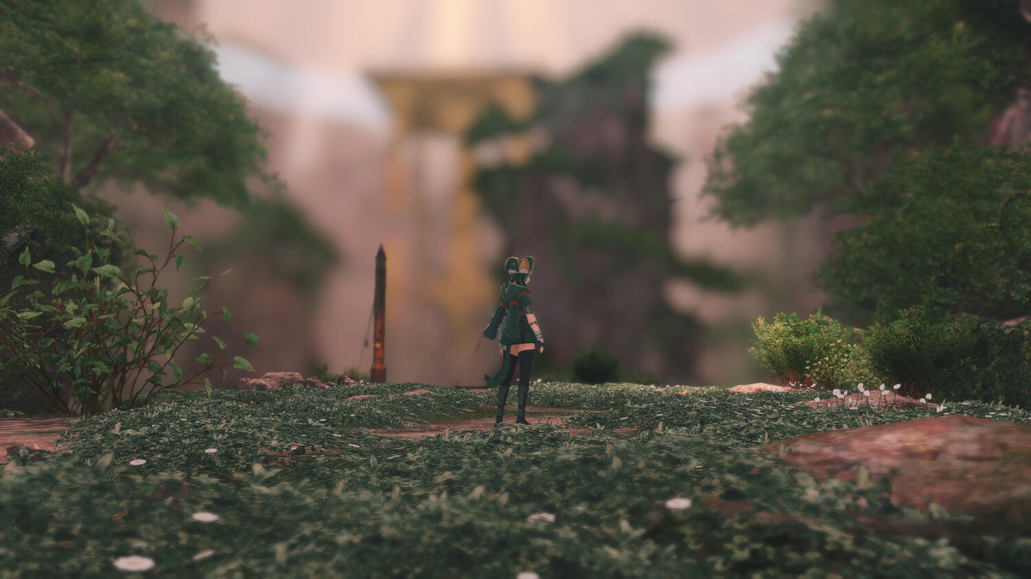 far shot of phoebe standing in a mountainous/forest area looking back at the camera
